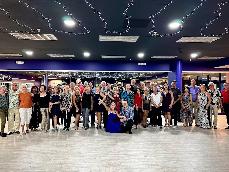 A group of people smiling for camera