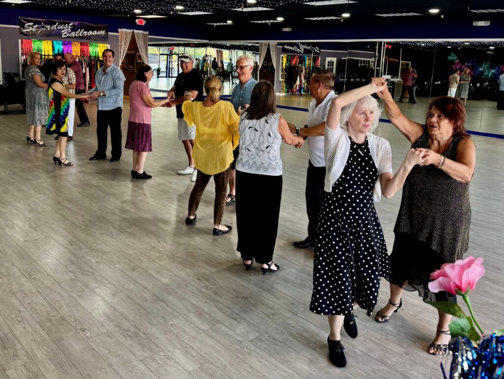 People line dancing at Stardust Ballroom